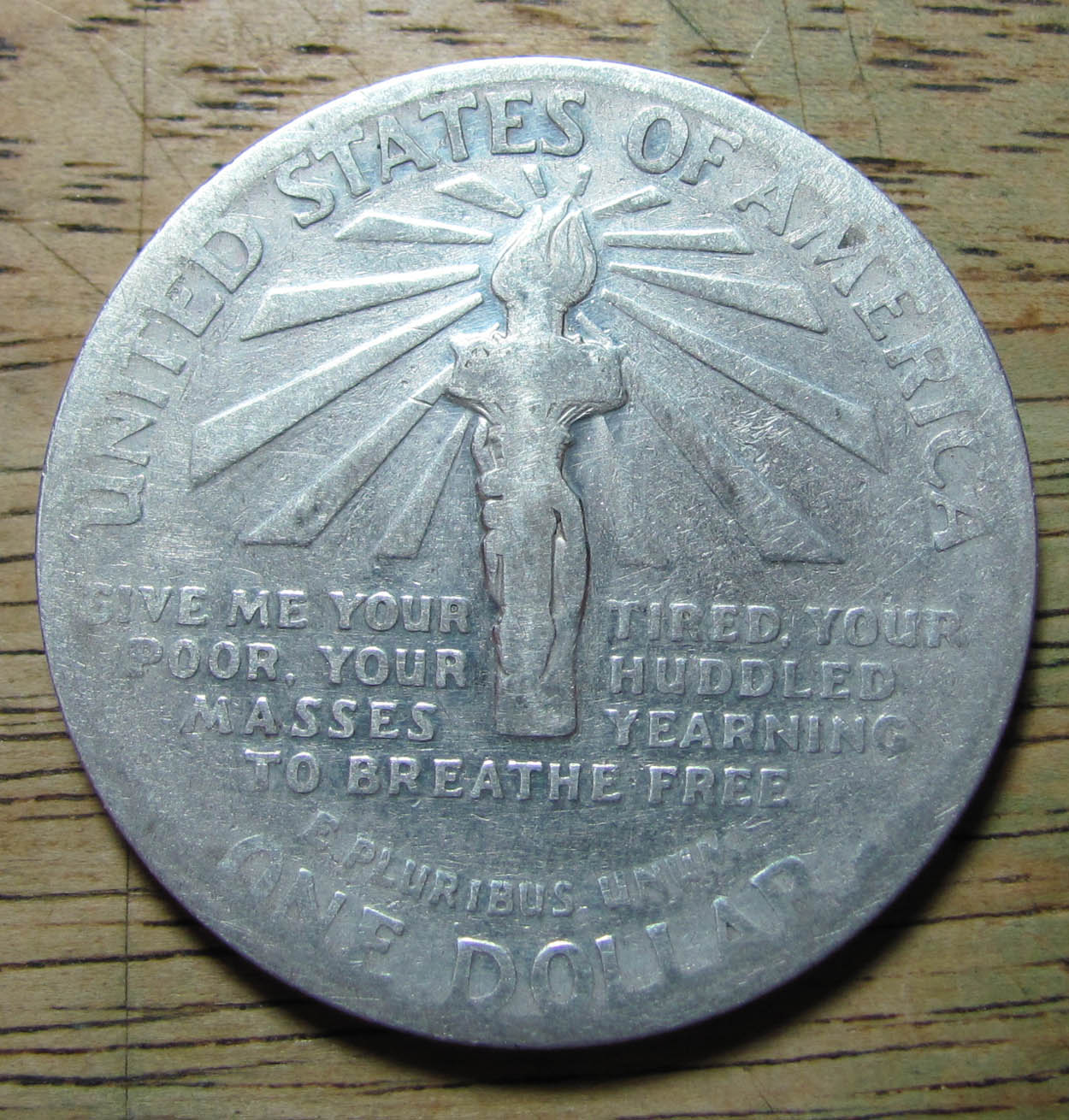 Ellis-Island-Dollar-Pocket-Piece-Grade